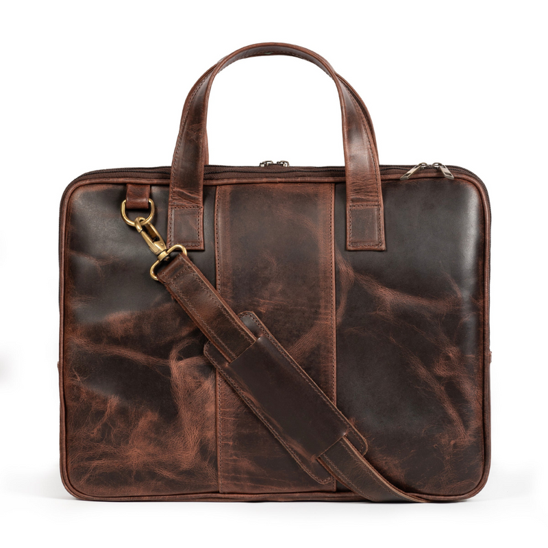 A dark brown leather briefcase with a removable shoulder strap and brass hardware, featuring a sleek and compact design.